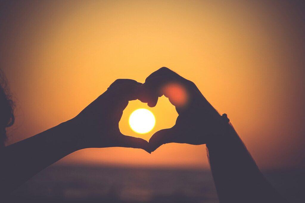 Sun Protection for Athletes: Why Skin Health Matters More Than You Think 2 silhouette of person's hands forming heart